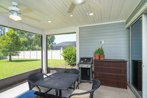 a view of a dining room with furniture window and a swimming pool