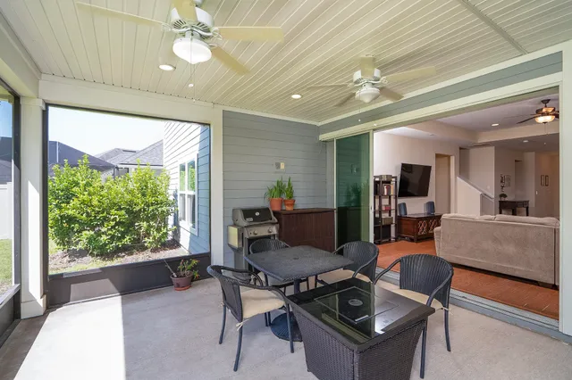 a kitchen with kitchen island granite countertop a sink a center island cabinets and appliances