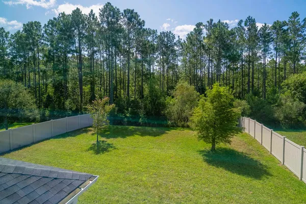 a view of a backyard with green space