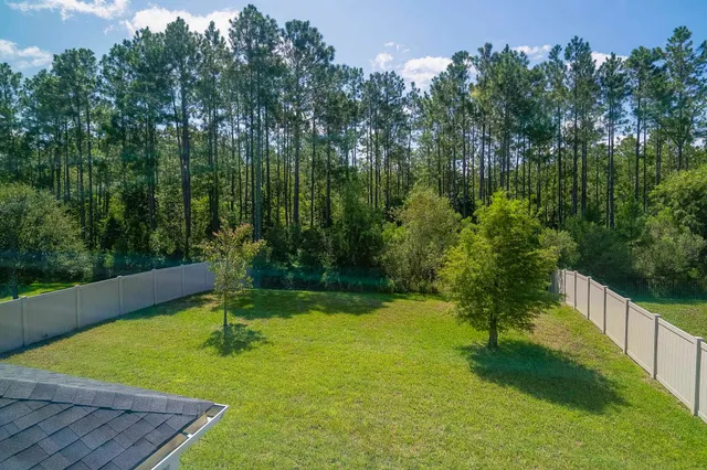 a view of a backyard with green space