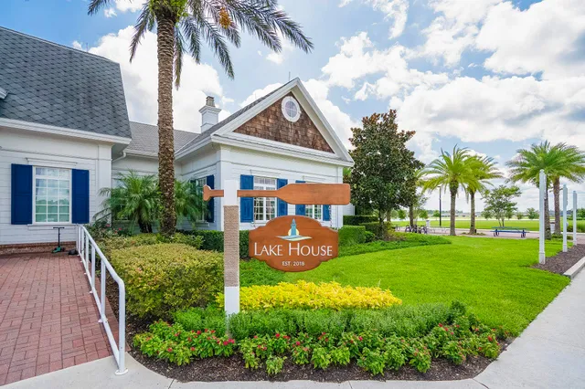 a bathroom with a sink vanity mirror and toilet