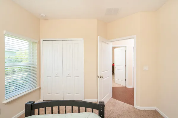 a view of a hallway with workspace and entryway