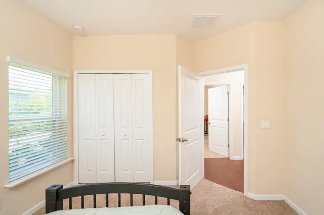 a view of a hallway with workspace and entryway