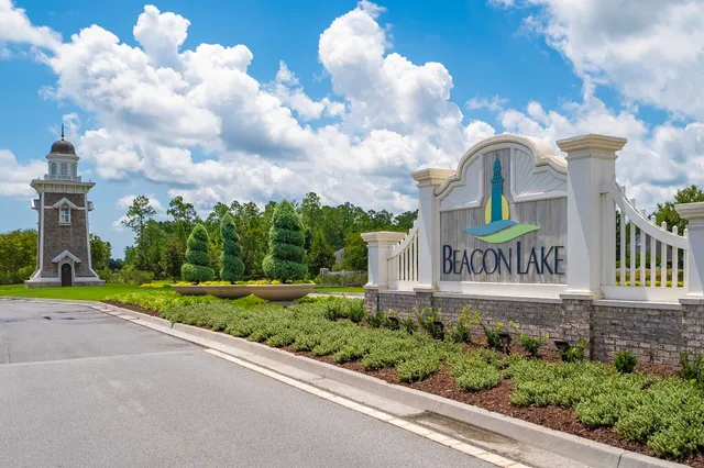a view of a backyard with swimming pool and fire pit