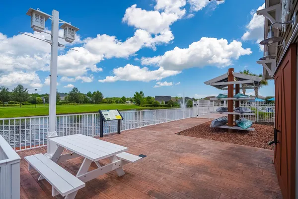 a view of a house with porch and garden