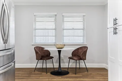 a view of a livingroom with furniture and a window