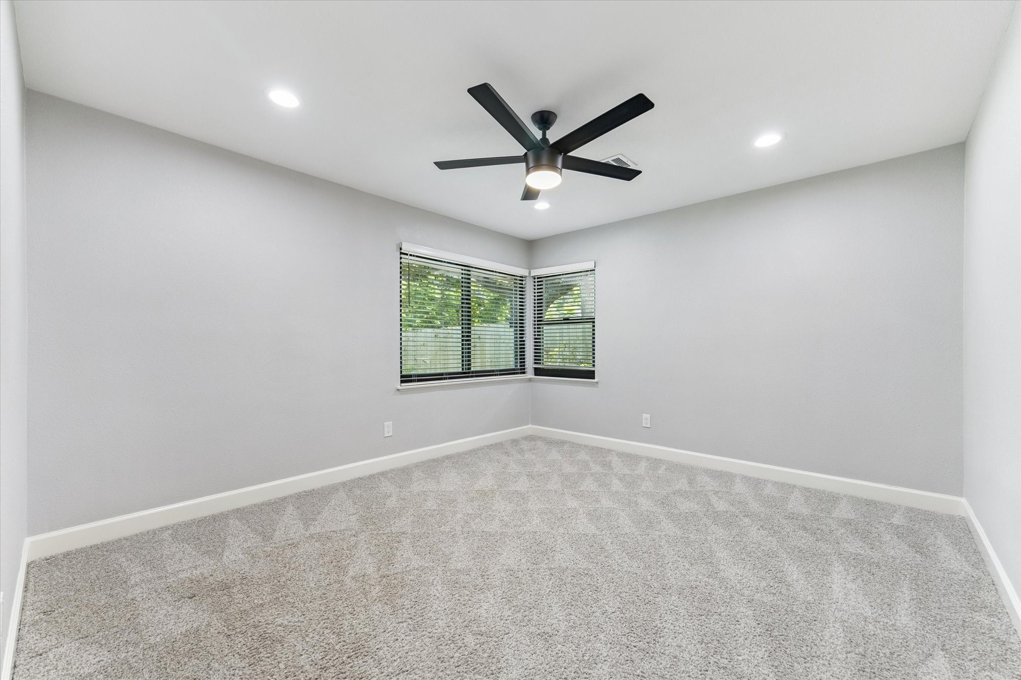 5414 Sanford Road Houston, TX 77096 - Photo 23 of 32 This carpeted secondary bedroom boasts a ceiling fan, recessed lighting, double exposures and a roomy closet.