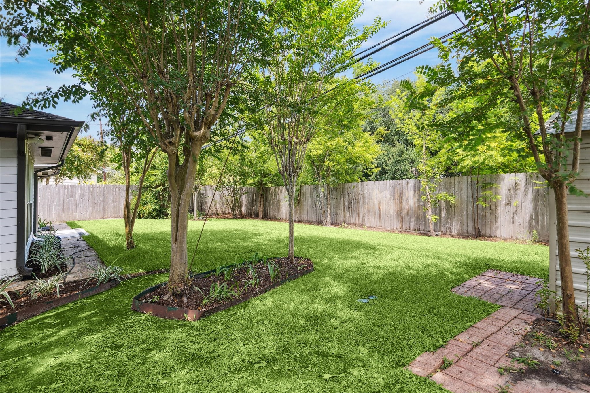 5414 Sanford Road Houston, TX 77096 - Photo 28 of 32 Enjoy wonderful peace and privacy in this fully fenced yard that abuts a greenbelt.