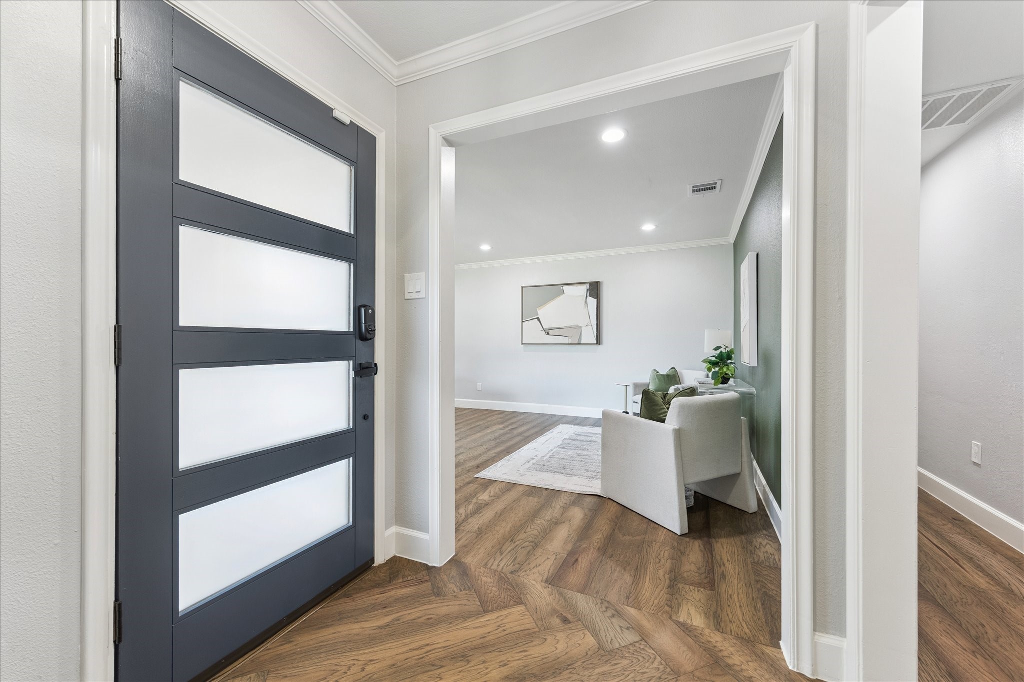 5414 Sanford Road Houston, TX 77096 - Photo 3 of 32 Renovated throughout in 2020 by Delta Homes, this 2,496-square-foot home shines with herringbone engineered hardwood floors, tall ceilings with recessed lighting, fantastic millwork and newer Andersen Fibrex composite windows.