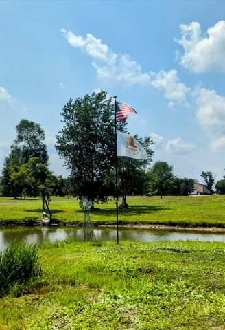 a view of a park and more houses