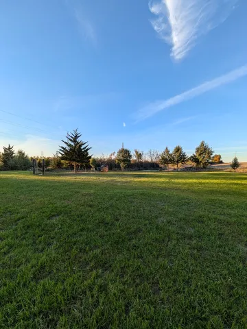 a view of a lake with a yard