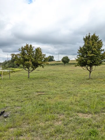 a view of a lake with a big yard