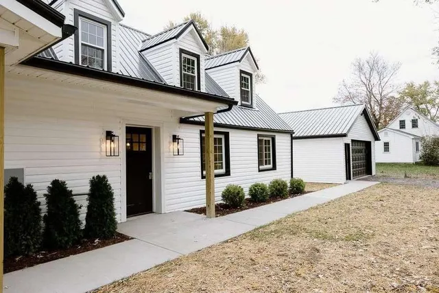 a front view of a house with garden