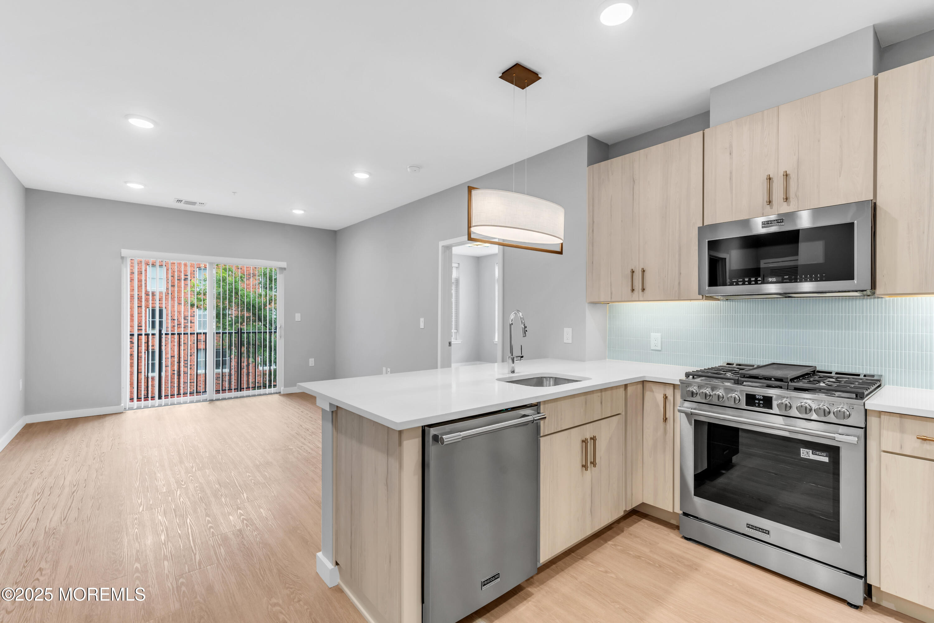 120 Monmouth Street, Unit 308 Red Bank, NJ 07701 - Photo 21 of 37 a kitchen with a stove and a sink