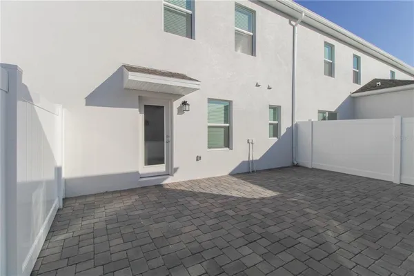 a view of a white house with a outdoor space