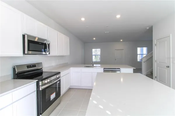 a kitchen with a stove and a microwave