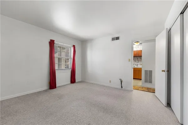 a view of a balcony with wooden floor