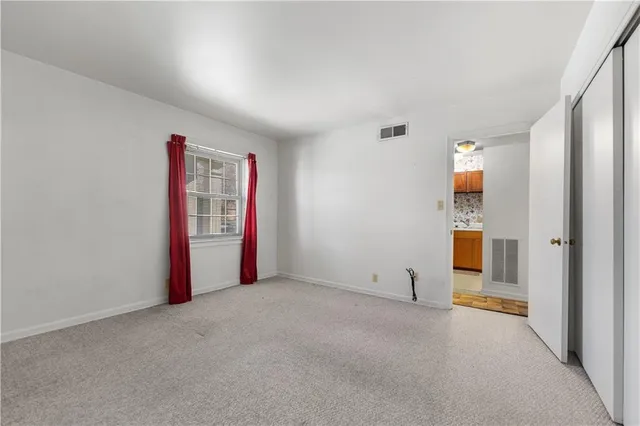 a view of a balcony with wooden floor