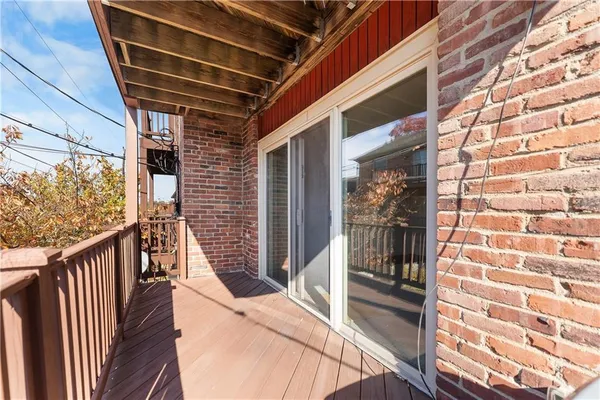 a car parked in front of a white house