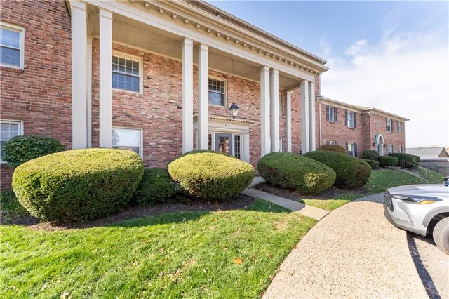 an aerial view of a house with swimming pool outdoor seating and yard