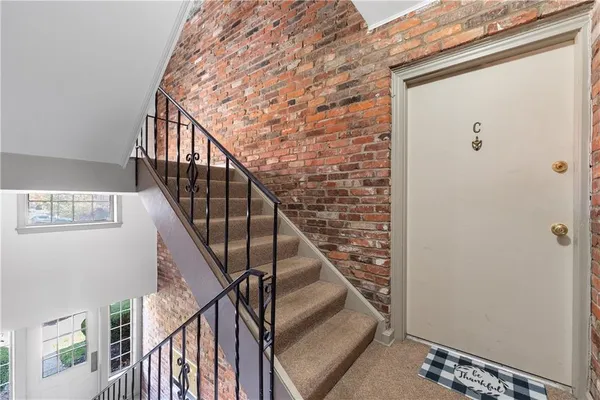 a view of entryway with wooden floor