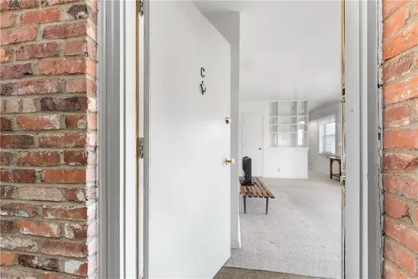 a view of a livingroom with furniture and window