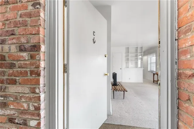 a view of a livingroom with furniture and window