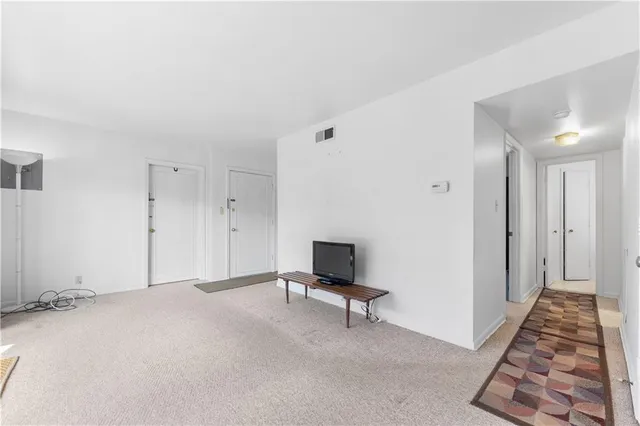 a view of hallway with wooden floor