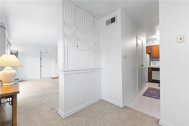 a view of a livingroom with furniture and a window