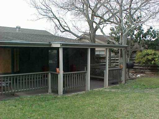 4022 Bray Drive Corpus Christi, TX 78413 - Photo 4 of 8 a front view of a house with a yard