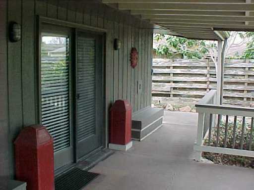 4022 Bray Drive Corpus Christi, TX 78413 - Photo 7 of 8 a view of a porch with furniture and a backyard