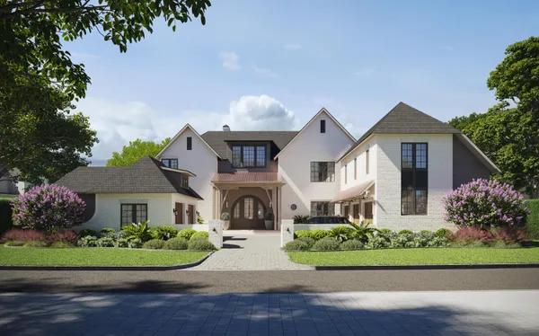 a front view of a house with a garden