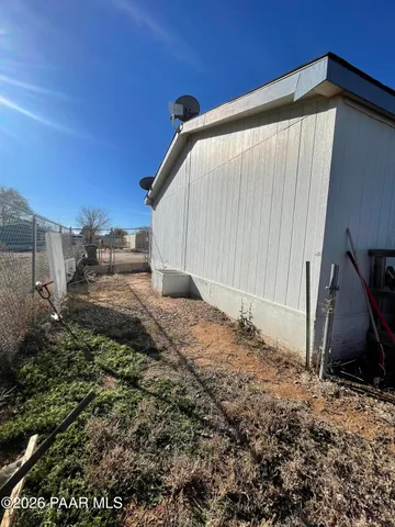 a view of a back yard of the house