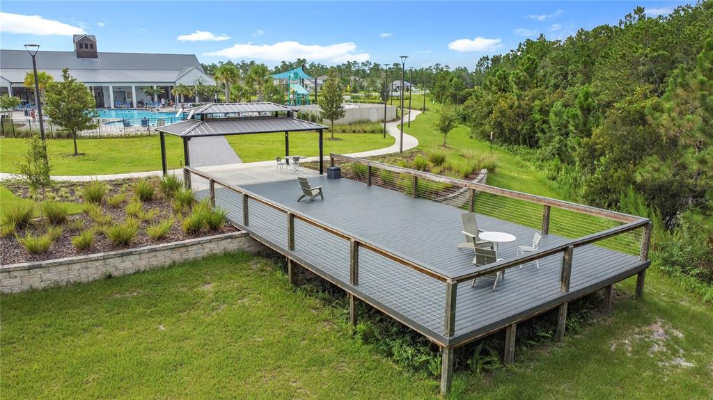 2914 Hudson Hammock Way St. Cloud, FL 34773 - Photo 12 of 30 a view of a swimming pool with a lounge chairs