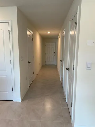 a bathroom with a toilet sink and shower
