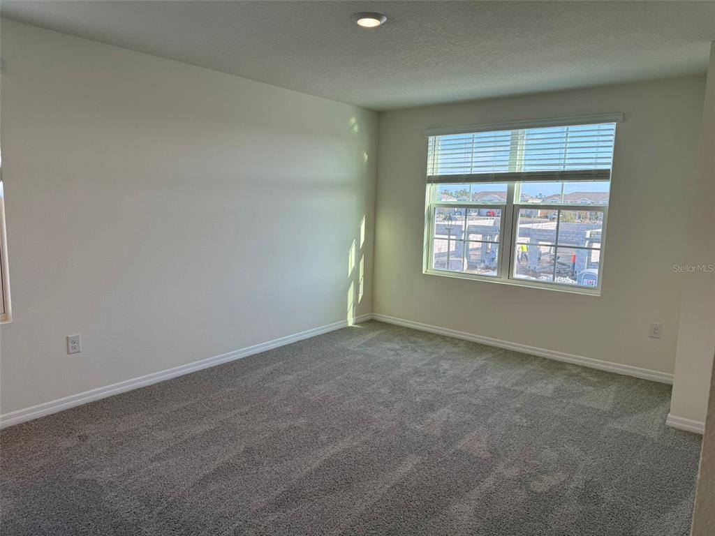 2914 Hudson Hammock Way St. Cloud, FL 34773 - Photo 28 of 30 an empty room with a window