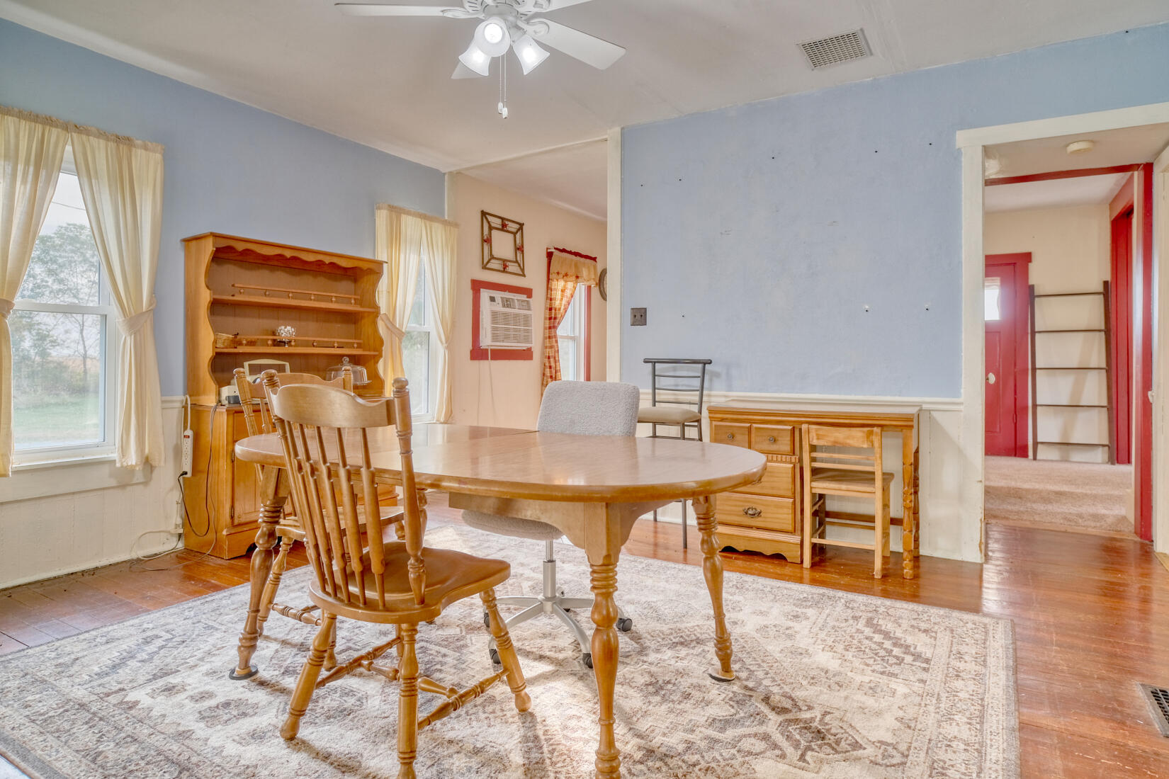 5790 West 700 South Morocco, IN 47963 - Photo 15 of 28 a view of a dining room with furniture and wooden floor