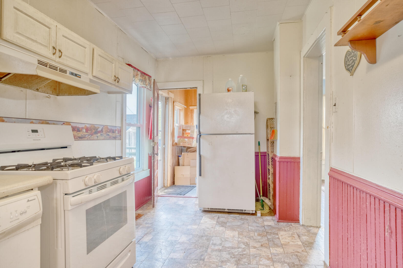 5790 West 700 South Morocco, IN 47963 - Photo 19 of 28 a kitchen with a stove top oven and refrigerator
