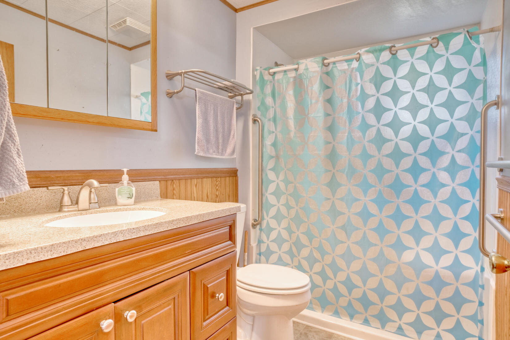 5790 West 700 South Morocco, IN 47963 - Photo 20 of 28 a bathroom with a sink a toilet and a shower curtain