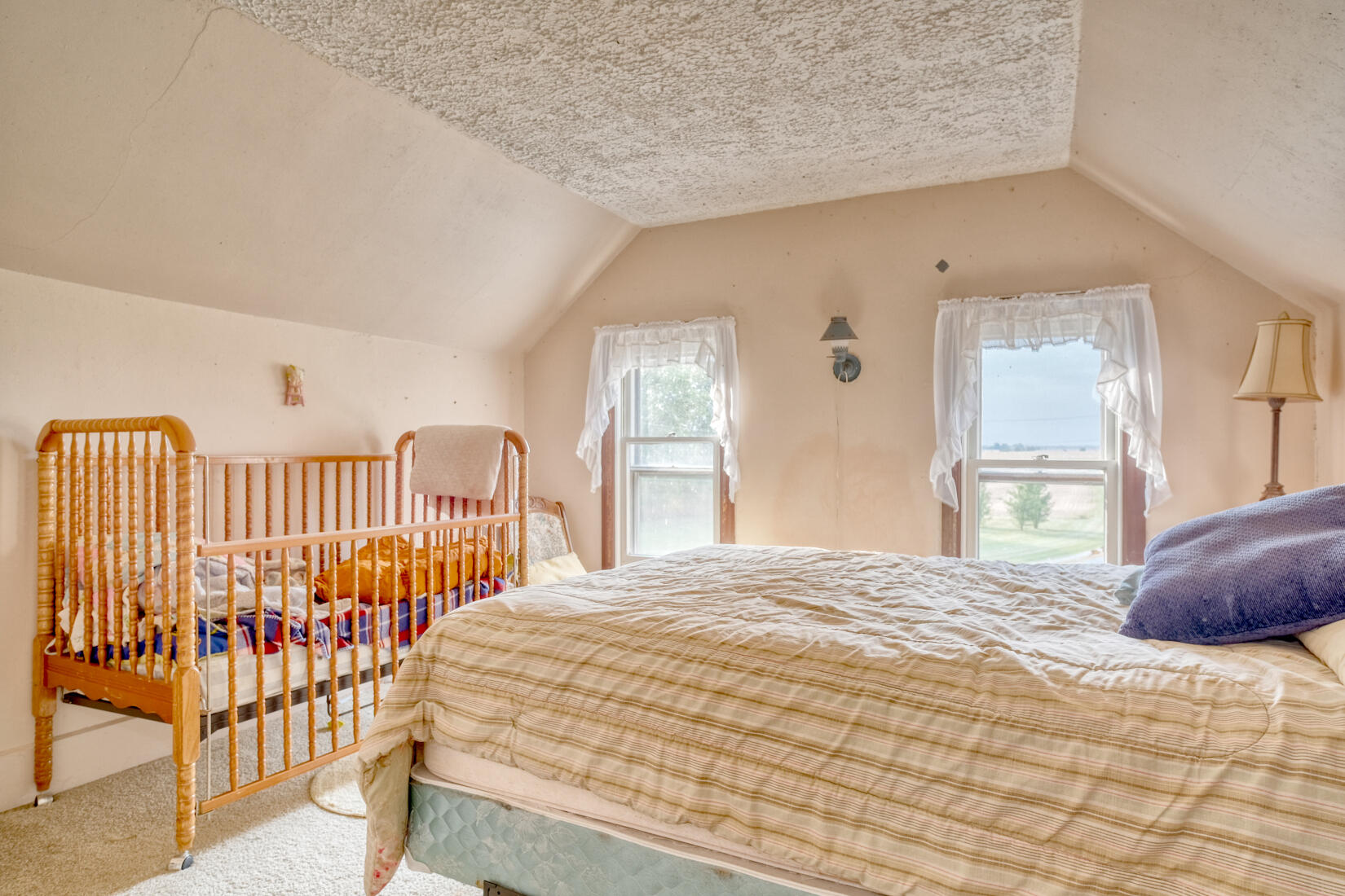 5790 West 700 South Morocco, IN 47963 - Photo 26 of 28 a bedroom with a bed and a window