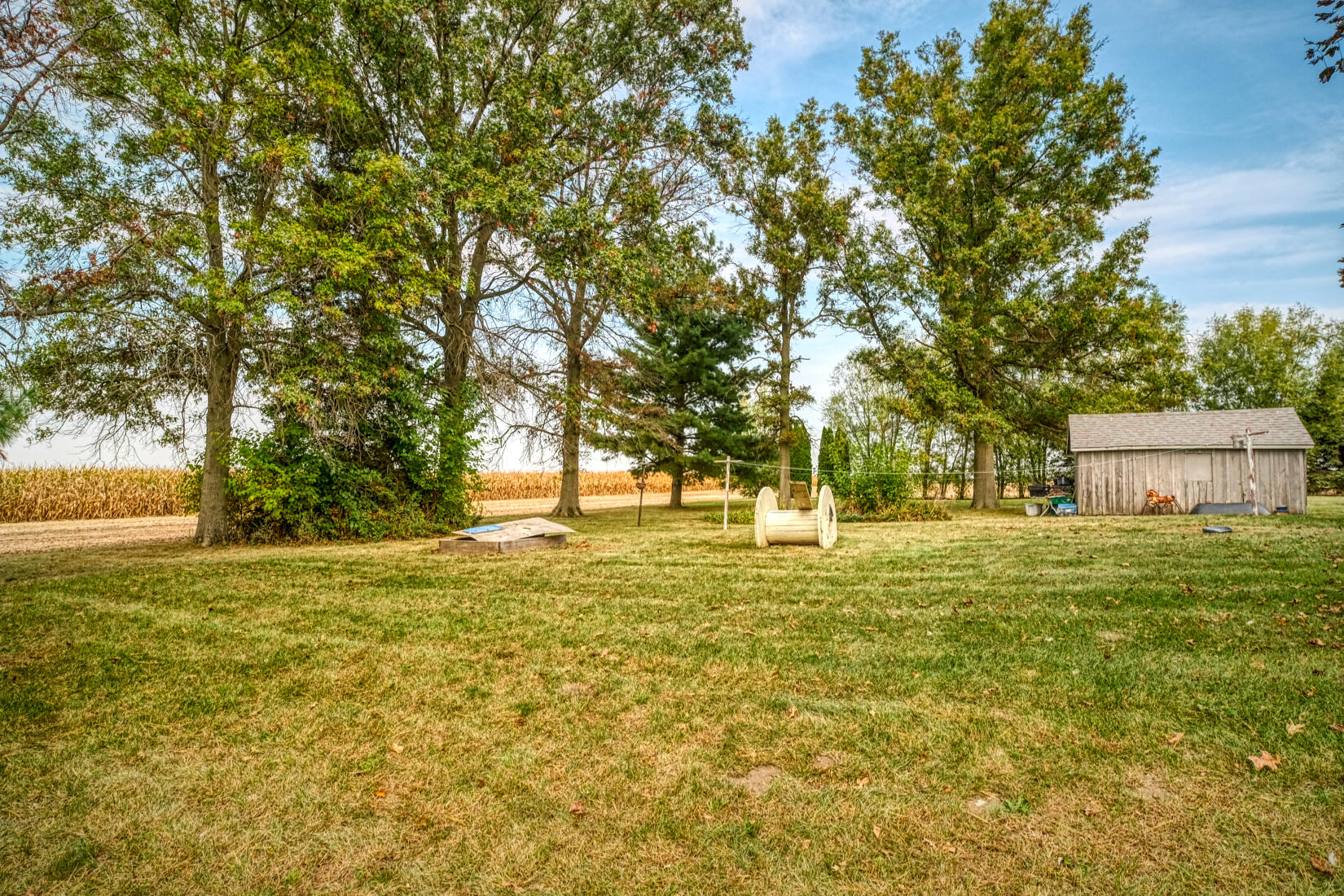 5790 West 700 South Morocco, IN 47963 - Photo 9 of 28 a view of a trees in front of a house with a garden