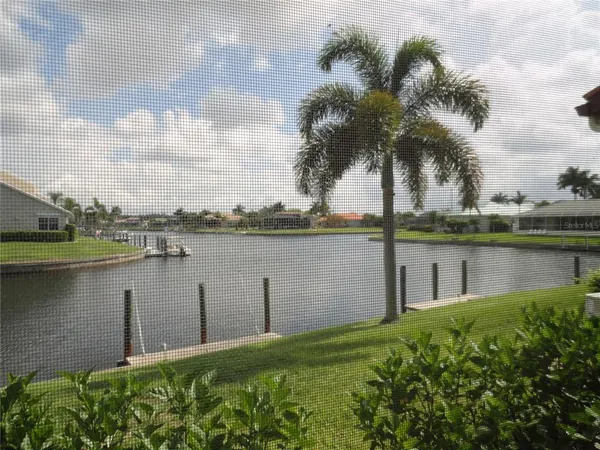 a view of a lake with a building in the background