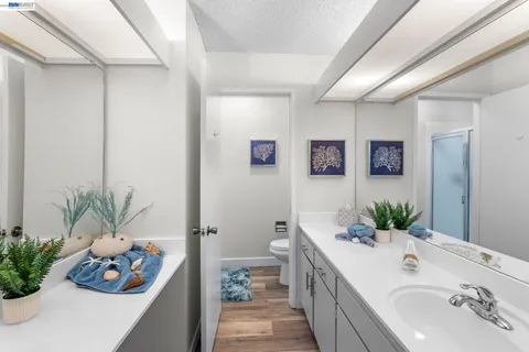 a spacious bathroom with a bathtub sink and toilet