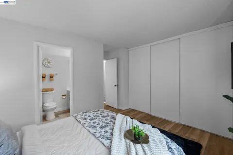 a bedroom with a bed and a table