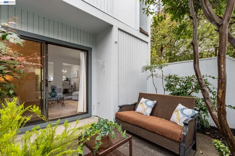 a view of a balcony with furniture