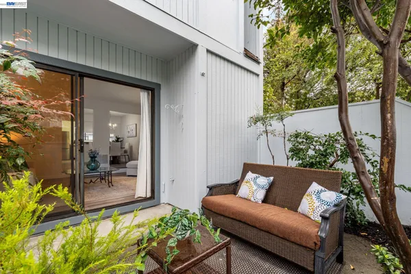 a view of a balcony with furniture