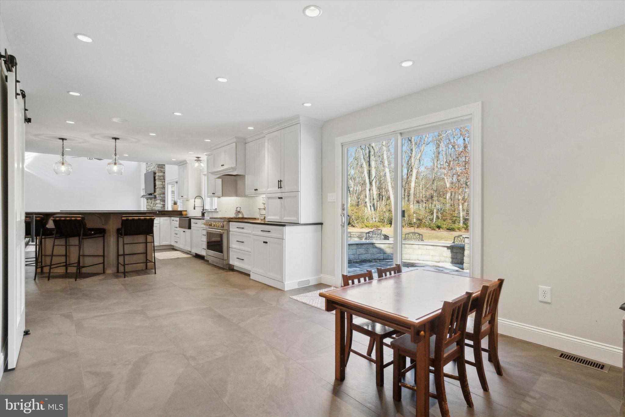 132 Hawkin Road New Egypt, NJ 08533 - Photo 15 of 42 a kitchen with a table and chairs in it
