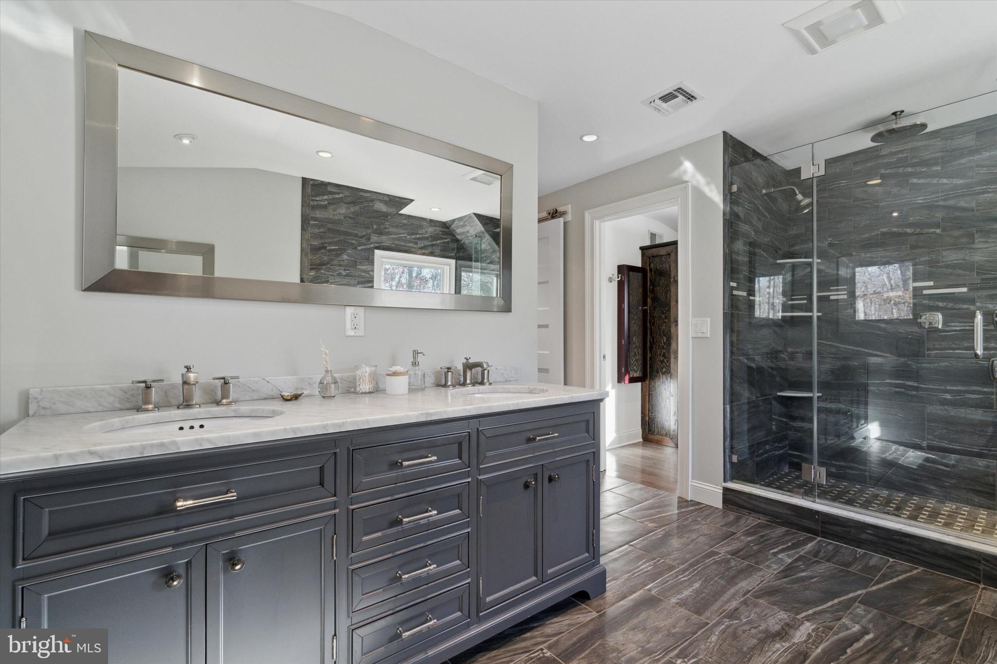 132 Hawkin Road New Egypt, NJ 08533 - Photo 20 of 42 a bathroom with a granite countertop sink mirror and double