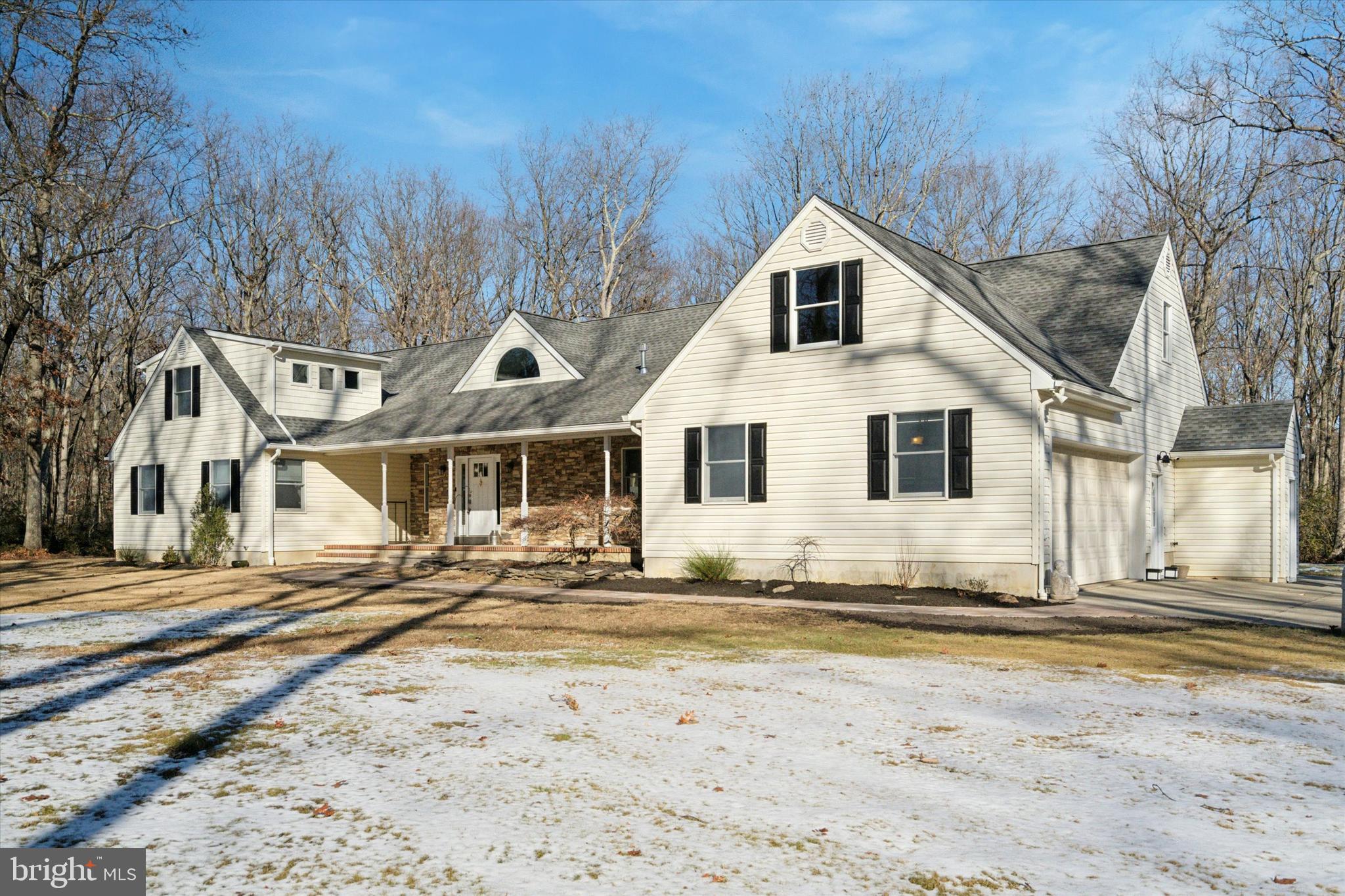 132 Hawkin Road New Egypt, NJ 08533 - Photo 3 of 42 a view of a house with snow on the side of it