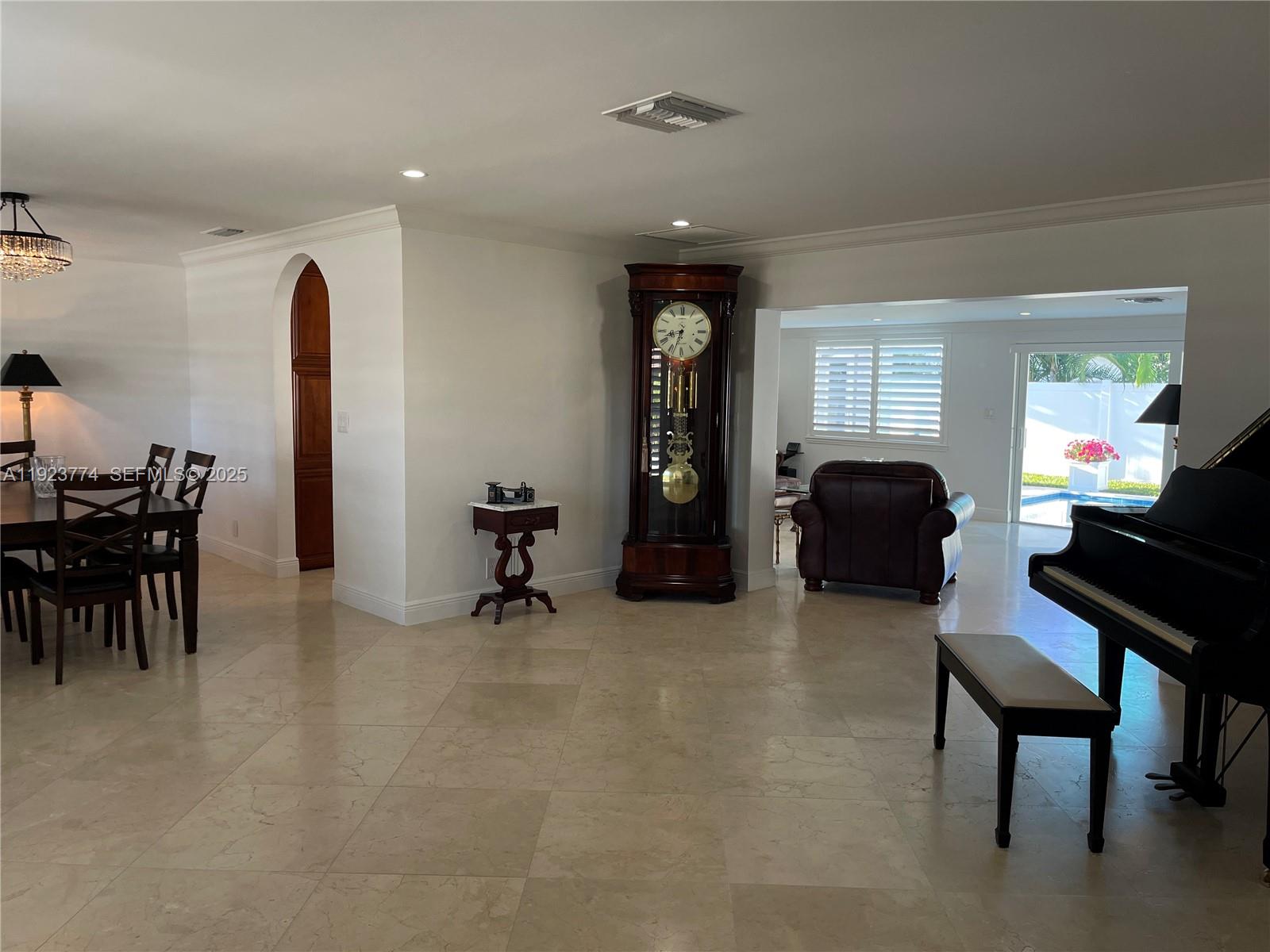 6611 Northeast 21st Lane Fort Lauderdale, FL 33308 - Photo 5 of 32 a view of a livingroom with furniture and a gym